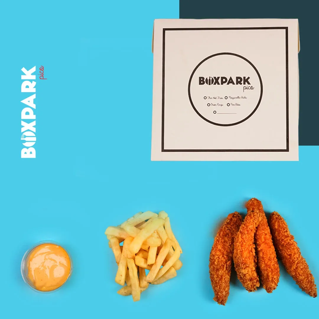 Fries, sauces and peri bites arranged around a menu card on cyan