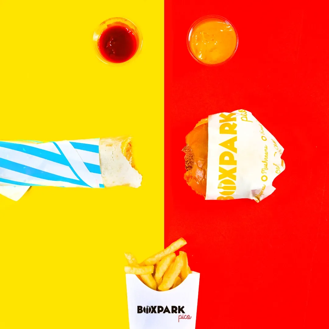 A wrap and sauces on split yellow and red