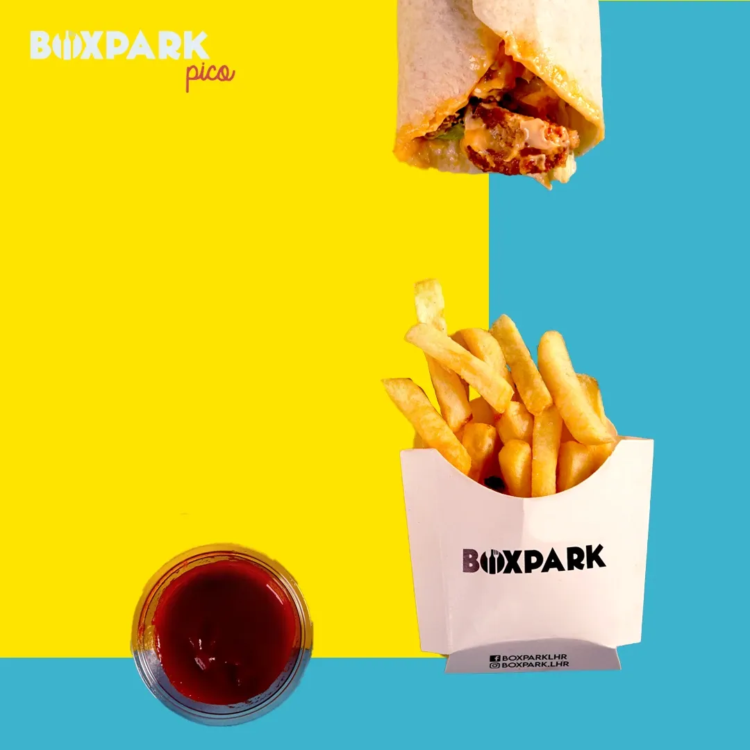 A wrap and branded fries box on yellow and cyan