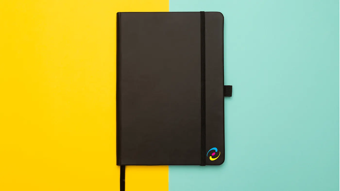 Branded notebook on a yellow and mint ground