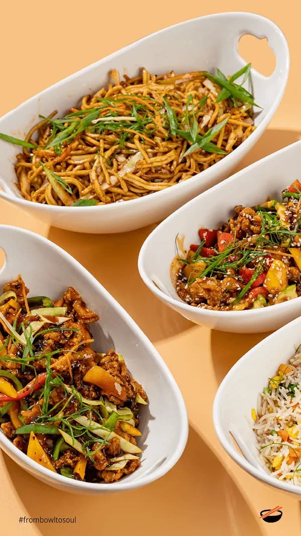 Story-format photograph of three white bowls of noodles and rice