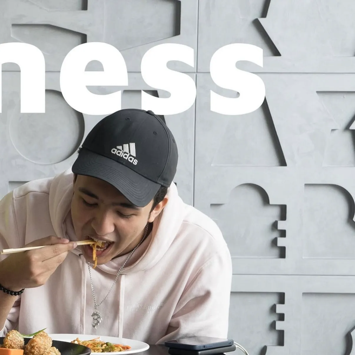A man in a cap eating from a bowl, right panel of the togetherness triptych