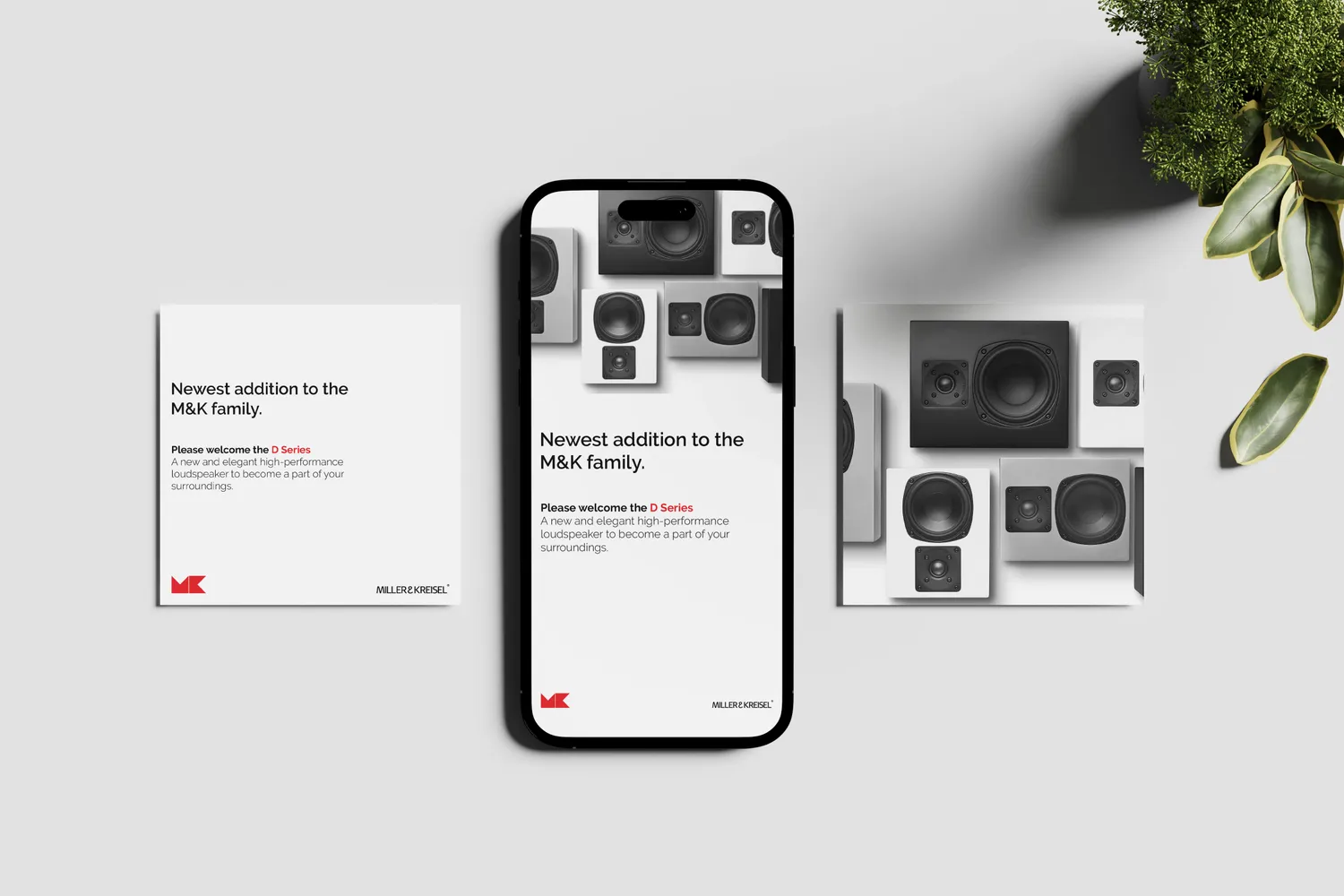Miller & Kreisel D Series announcement card and phone post beside a grid of loudspeakers